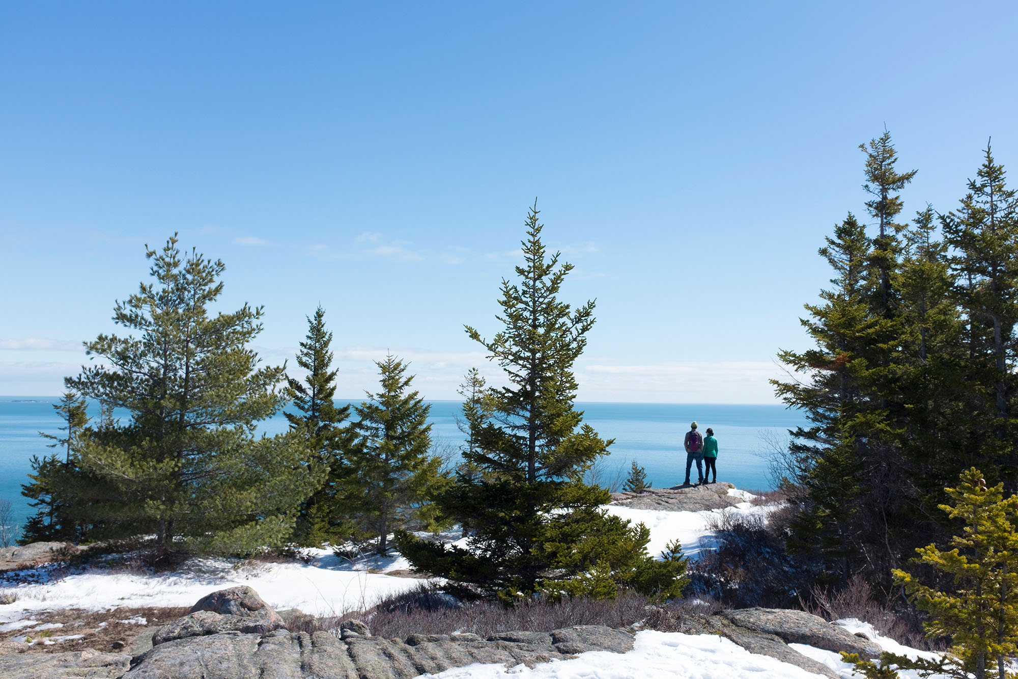 Photo of Couple standing at scenic overlook hiking in Acadia National Park