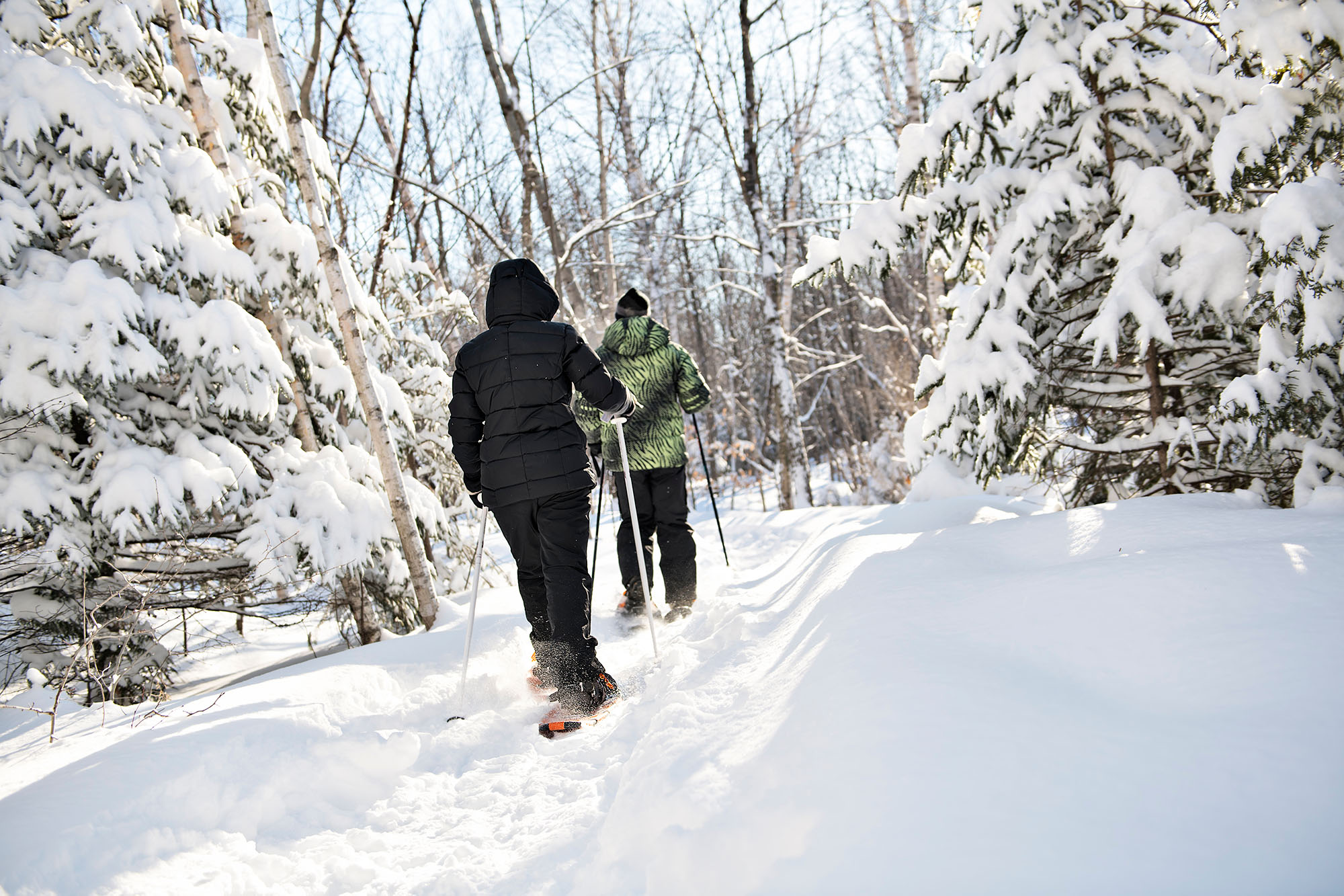 Photo of a couple snowshoeing in the Winter in Acadia National Park