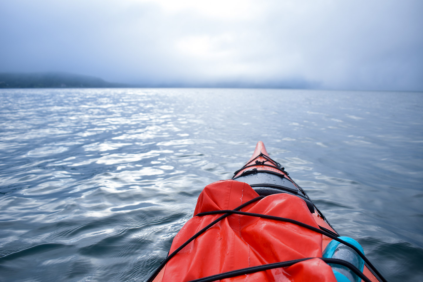 First-Person Perspective of an Orange Kayak on the Ocean